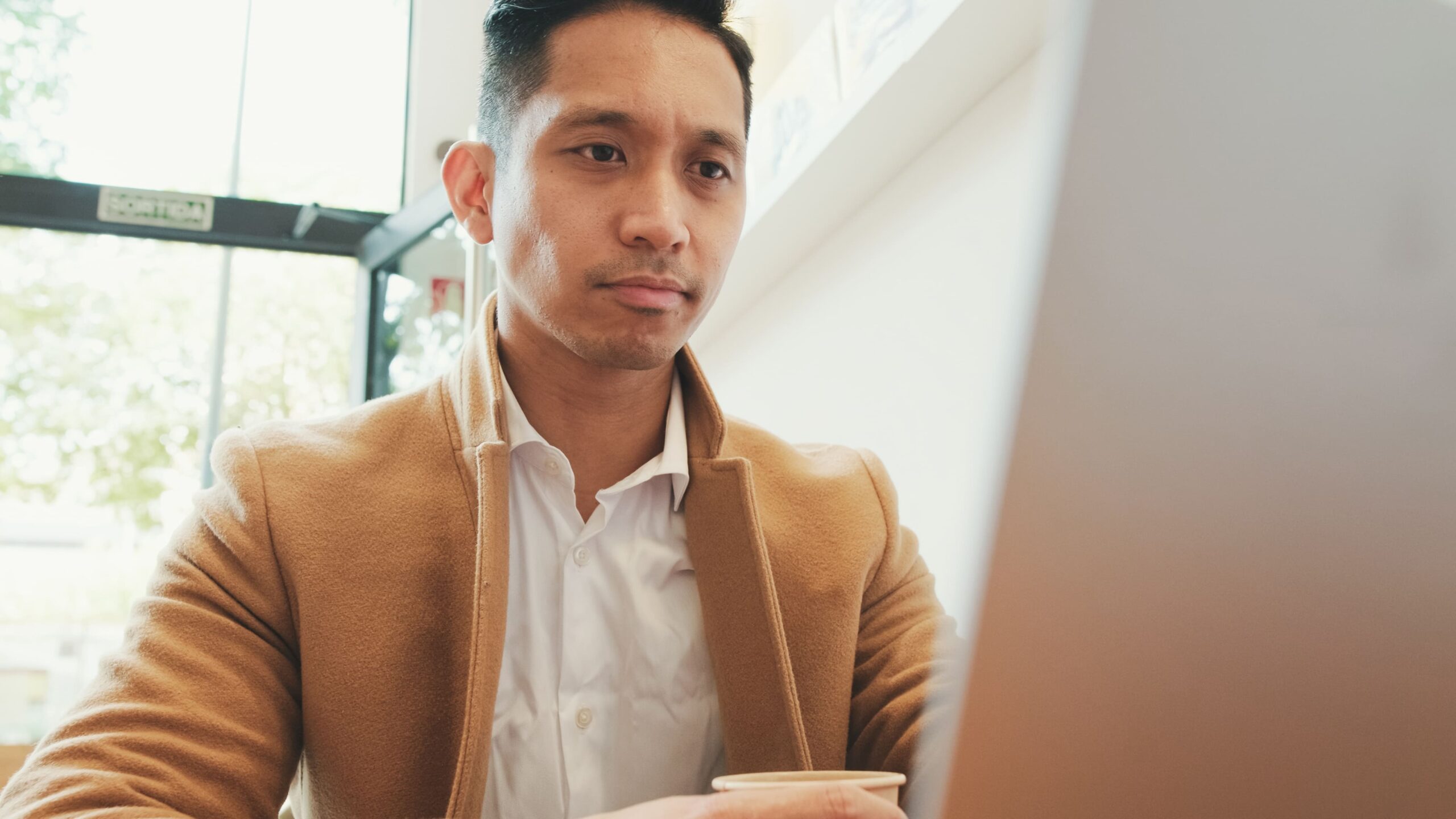Client Success Advocate working at a desk